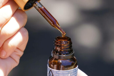 A bottle of CBD open with the dropper