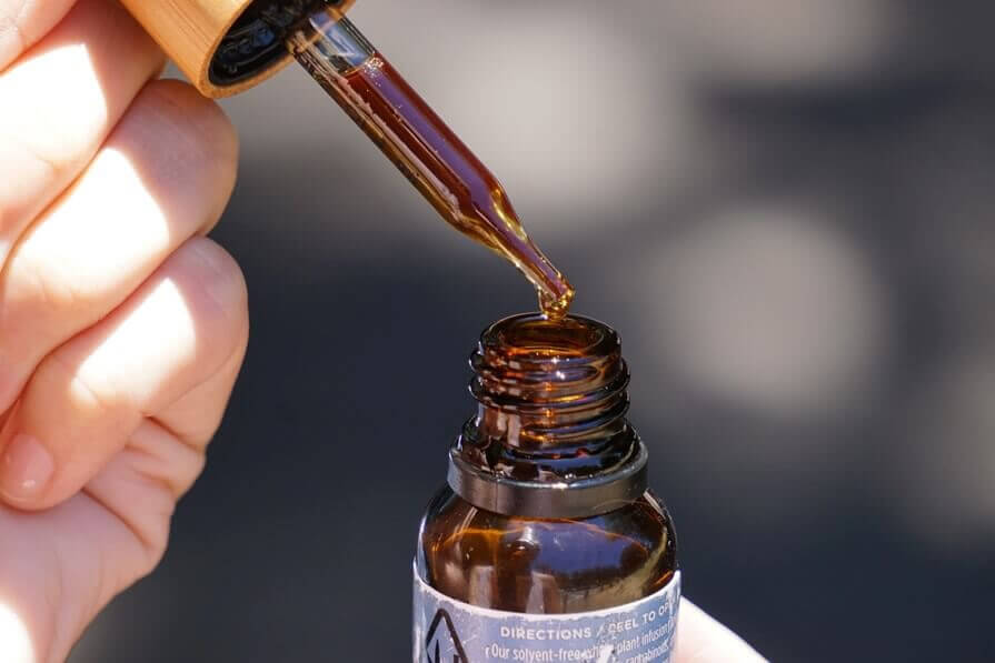 A bottle of CBD open with the dropper